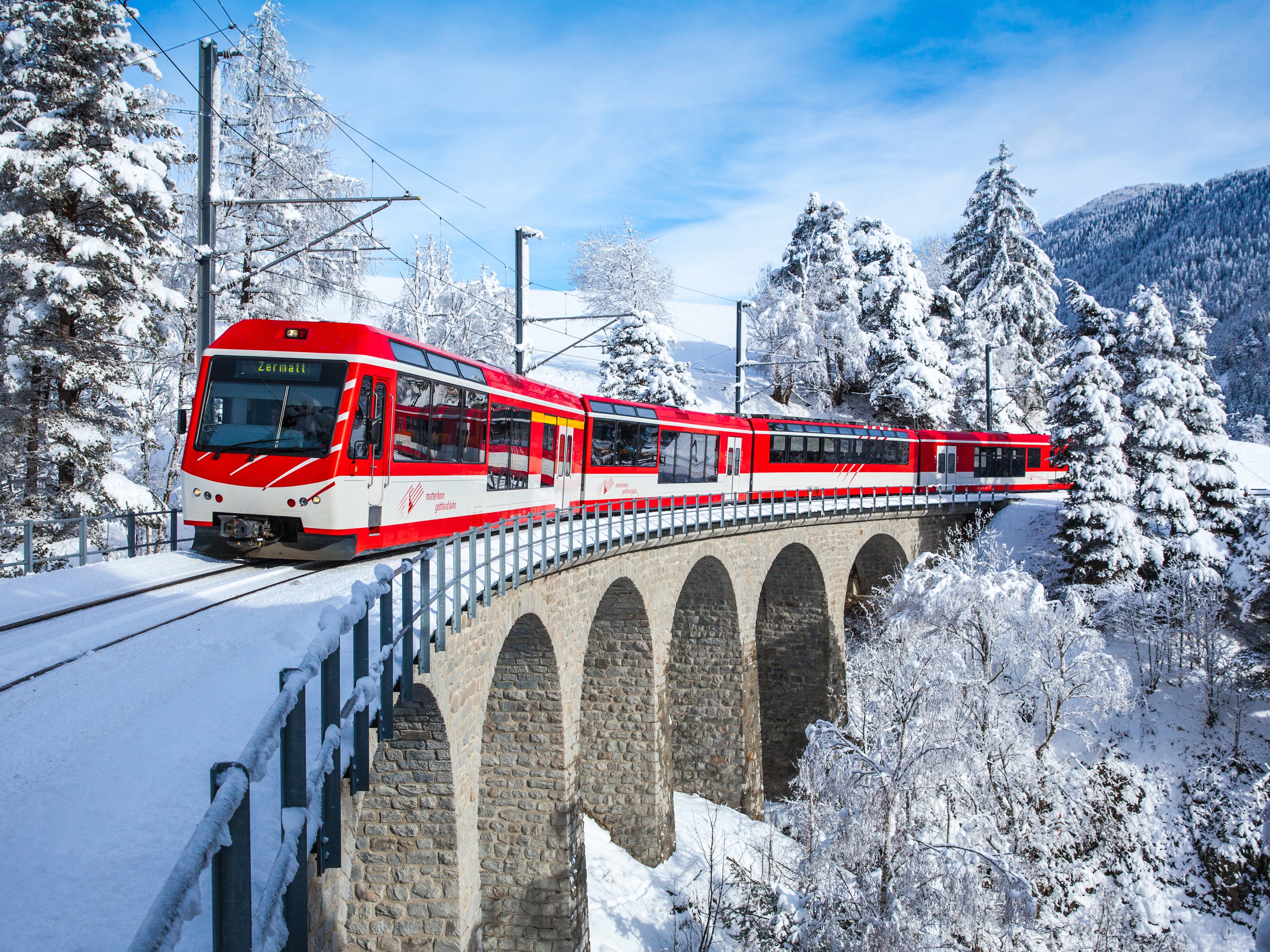 Scenic Swiss rail journey through an alpine valley